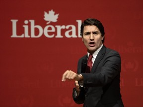 Justin Trudeau speaks at a Liberal fundraiser, in Gatineau, Que. The prime minister is being ripped online for his smug response after being questioned about accpeting a free vacation over the holidays.