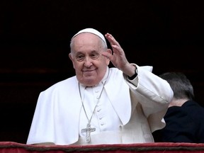 Pope Francis arrives for the Christmas Urbi et Orbi blessing in St. Peter's Square at The Vatican on December 25, 2023.