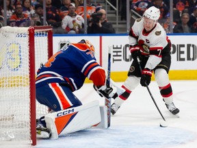 Brady Tkachuk of the Ottawa Senators takes a shot against goaltender Stuart Skinner of the Edmonton Oilers during the second period at Rogers Place on Jan. 6, 2024.