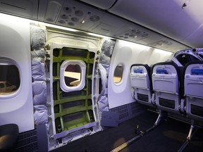 A door plug area of an Alaska Airlines Boeing 737 Max 9 aircraft awaiting inspection is pictured with panelling removed