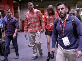 Kansas City Chiefs tight end Travis Kelce and singer Taylor Swift leave Arrowhead stadium after an NFL football game between the Chiefs and the Los Angeles Chargers, Sunday, Oct. 22, 2023.