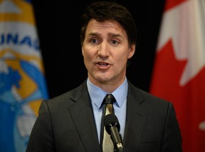 Prime Minister Justin Trudeau answers questions at a press conference following the signing of the Nunavut devolution agreement in Iqaluit, Thursday, Jan. 18, 2024.