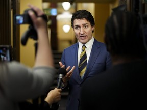 Prime Minister Justin Trudeau speaks to reporters in the foyer of the House of Commons on Parliament Hill in Ottawa on Wednesday, Dec. 13, 2023. THE CANADIAN PRESS/Sean Kilpatrick