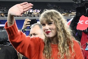 Taylor Swift waves after the AFC Championship game between the Baltimore Ravens and the Kansas City Chiefs, Sunday, Jan. 28, 2024, in Baltimore.