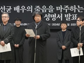 South Korean director Bong Joon-ho, center, speaks during a press conference demanding an investigation into the case for the death of the late actor Lee Sun-kyun in Seoul, South Korea, Friday, Jan. 12, 2024.