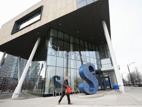 A person walks past Sheridan College's Hazel McCallion Campus in Mississauga, Ont., Friday, Jan. 26, 2024. Ontario says all colleges and universities will be required to guarantee housing for incoming international students.