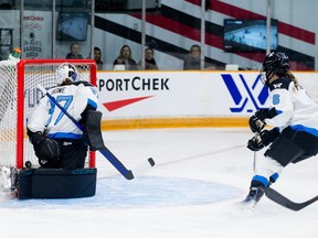 Toronto goalie Erica Howe and defender Kali Flanagan watch as a shot from Ottawa forward Emily Clark enters the net during the first period at TD Place Arena on Tuesday, Jan. 23, 2024.