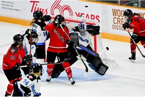 Toronto goalie Erica Howe reacts to a floating puck as Ottawa players attempt to regain possession during the second period at TD Place Arena on Tuesday, Jan. 23, 2024.