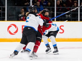 Ottawa forward Daryl Watts collides with Toronto defender Lauriane Rougeau during the third period