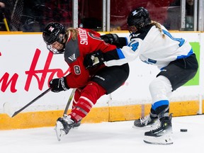 Ottawa forward Natalie Snodgrass works against Toronto defender Renata Fast during the first period at TD Place Arena on Tuesday, Jan. 23, 2024.