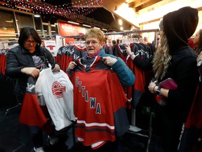 Fans arrive for the PWHL home opener between Ottawa and Montreal at the TD Place Arena in Ottawa on Tuesday.