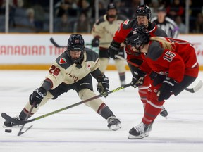 Ottawa's Savannah Harmon tries to get the puck past Montreal's Sarah Bujold during the second period against Montreal on Tuesday night at TD Place Arena.