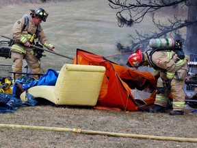 Ottawa firefighters put out a fire at a homeless camp on Tremblay Road on Wednesday. No one was hurt.