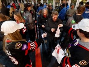Fans arrive for the PWHL home opener between Ottawa and Montreal at the TD Place Arena in Ottawa on Tuesday.