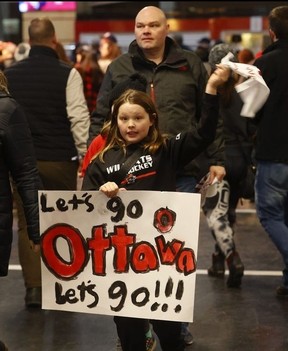 Fans arrive for the PWHL home opener between Ottawa and Montreal at the TD Place Arena in Ottawa on Tuesday.