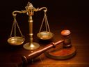 Scales of justice and wooden gavel.