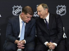 NHLPA executive director Marty Walsh (left) and NHL commissioner Gary Bettman
