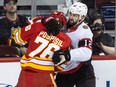 Calgary Flames centre Martin Pospisil and Ottawa Senators centre Mark Kastelic slug it out.