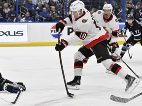 Ottawa Senators centre Tim Stutzle (18) scores as Tampa Bay Lightning defenceman Darren Raddysh (43) dives during the first period.