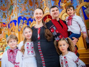 Liliya Terenyak, her husband Artem Terenyak, and their children, eight-year-old Taras Terenyak, nine-year-old Yaryna Terenyak, five-year-old Solomiia Terenyak, and three-year-old Ostap Terenyak, all wearing Ukrainian vyshyvanka, traditional embroidered clothing, Saturday, Feb. 24, 2024, at the Ukrainian Orthodox Cathedral.