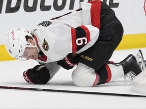 Ottawa Senators centre Josh Norris falls to the ice injured during the second period of an NHL hockey game against the Nashville Predators.