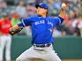 Blue Jays starter Hyun-Jin Ryu pitches in the first inning against the Cleveland Guardians at Progressive Field on Aug. 7, 2023 in Cleveland.