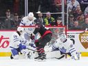 Claude Giroux of the Senators finds a loose puck and backhands it past Leafs goalie Martin Jones for Ottawa's first goal of the game.