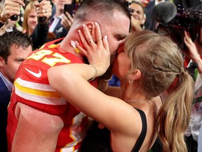 Travis Kelce of the Kansas City Chiefs kisses Taylor Swift after defeating the San Francisco 49ers at Super Bowl LVIII in Las Vegas.