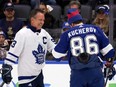 Nikita Kucherov, right, of the Lightning high fives former Maple Leaf Doug Gilmour