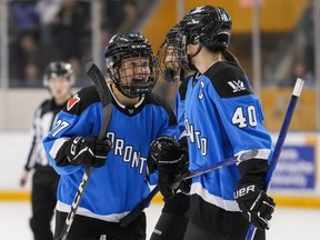 Toronto's Emma Maltais (27) celebrates her goal with teammate Blayre Turnbull (40) during third period PWHL action against New York in Toronto, Friday, Feb. 23, 2024.
