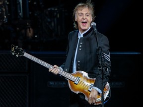 Paul McCartney performs during a concert as part of his One on One tour at the Hollywood Casino Amphitheatre in Tinley Park, Illinois.