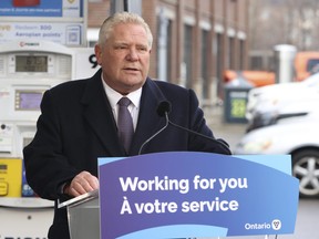 Ontario Premier Doug Ford speaks to media in Mississauga's Port Credit area on Tuesday. February 13, 2024.
