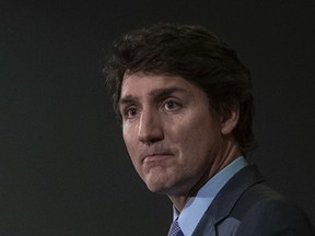 Prime Minister Justin Trudeau pauses during his speech to medical professionals and guests during the Vancouver Medical Association's 99th Annual Osler Dinner in Richmond, B.C. on Tuesday, Feb. 20, 2024. THE CANADIAN PRESS/Ethan Cairns