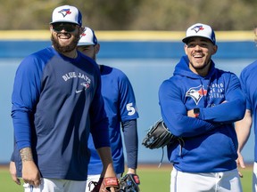 Blue Jays pitchers Alek Manoah (left) and Jose Berreos share a laugh during Spring Training action in Dunedin.