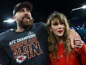 Travis Kelce of the Kansas City Chiefs (left) celebrates with Taylor Swift