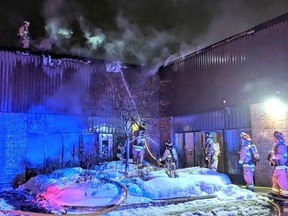 Firefighters quelled a stubborn fire at a business on Canotek Road Wednesday night