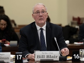 Defence Minister Bill Blair waits to appear as a witness at the National Defence committee, Monday, Feb. 12, 2024 in Ottawa.