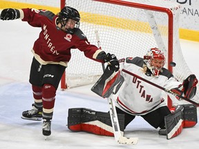 Montreal's Claire Dalton (42) tries to tip the puck past Ottawa goaltender Emerance Maschmeyer during third period PWHL hockey action in Montreal, Saturday, Feb. 24, 2024.