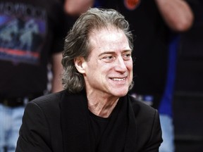 FILE - Comedian Richard Lewis attends an NBA basketball game in Los Angeles on Dec. 25, 2012.