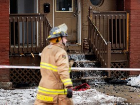 Members of the Ottawa Fire Service (OFS) work the scene of a two-alarm fire in the Sandy Hill region of Ottawa, on Thursday, Feb. 1, 2024.