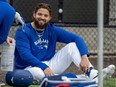 Toronto Blue Jays pitcher Alek Manoah chats with coaches while watching live batting practice during Spring Training.