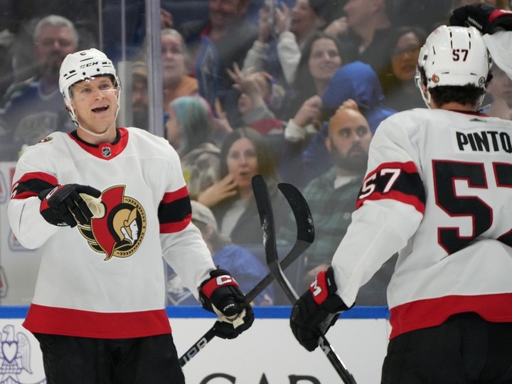  Jakob Chychrun of the Ottawa Senators celebrates with Shane Pinto after a goal against the Buffalo Sabres during the first period at KeyBank Center on March 27, 2024 in Buffalo.