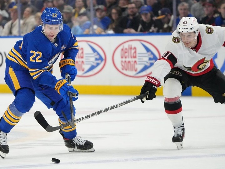  Jack Quinn of the Buffalo Sabres skates with the puck as Dominik Kubalik of the Ottawa Senators defends during the first period.