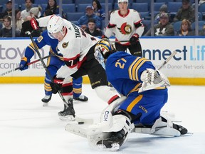Brady Tkachuk of the Ottawa Senators scores a goal against Devon Levi of the Buffalo Sabres during the first period at KeyBank Center on March 27, 2024 in Buffalo.