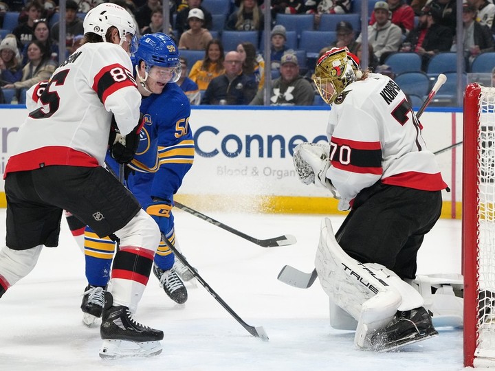  Joonas Korpisalo of the Ottawa Senators makes the save against Eric Robinson of the Buffalo Sabres during the second period at KeyBank Center on March 27, 2024 in Buffalo.