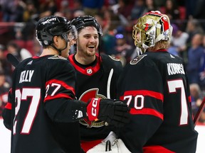 Parker Kelly and Drake Batherson of the Ottawa Senators celebrate with goalie Joonas Korpisalo after defeating the Edmonton Oilers at the Canadian Tire Centre on Sunday. Korpisalo will be in goal again on Thursday in Buffalo after back-to-back weekend wins.