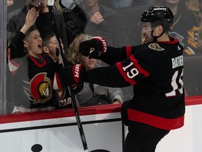 The Ottawa Senators' Drake Batherson celebrates with fans after his career-high 23rd goal of the season sealed a 2-1 overtime win over Pittsburgh at the Canadian Tire Centre on Tuesday, March 12, 2024.