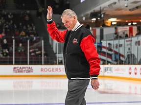 Brian Kilrea, coach of the Ottawa 67's 1999 Memorial Cup-winning squad, acknowledges the crowd before the Legacy Game on Sunday at TD Place.