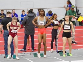 CeCe Telfer (second from left) competes in an NCAA track and field event