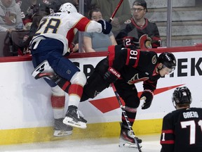 Florida Panthers defenceman Josh Mahura collides with Ottawa Senators left winger Dominik Kubalik along the boards.